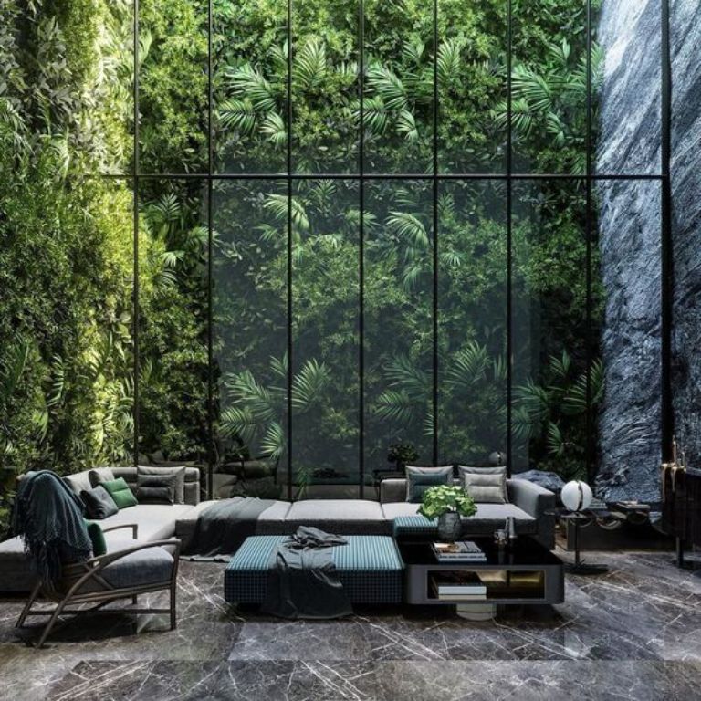 Phòng khách nếu được thiết kế thêm vách kính cường lực sẽ tạo ra rất nhiều không gian đặc biệt